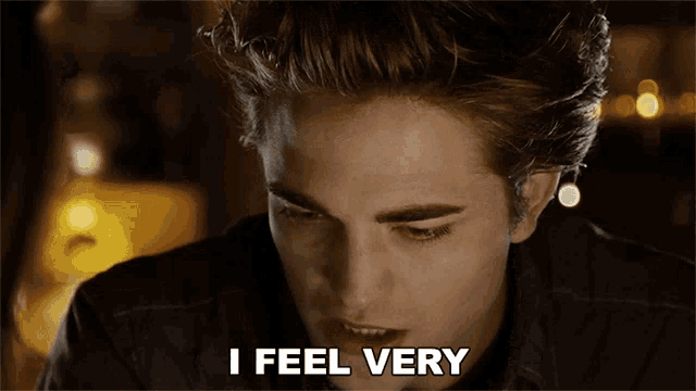 The image is from the Twilight series featuring Edward Cullen, played by Robert Pattinson. Edward is looking down with a contemplative expression, and the caption reads, "I feel very protective of you," highlighting his concern and desire to keep Bella safe.