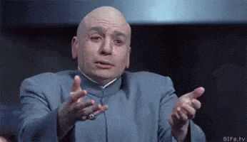 The character Dr. Evil, from the Austin Powers series, gestures with open hands and a confused or pleading expression, as if saying, "Why?" or "What do you want from me?" His body language and facial expression convey a mix of exasperation and sarcasm, typical of his comedic and villainous persona. The setting appears formal, matching his iconic gray suit.